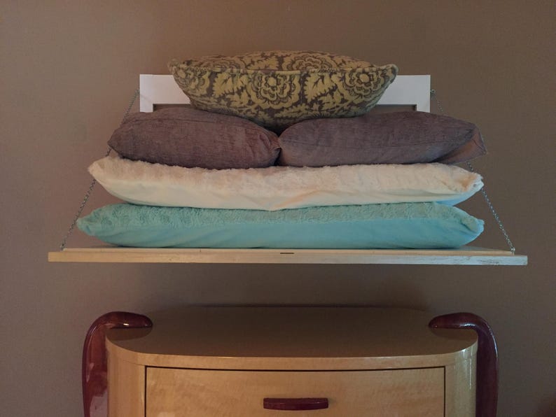 White Secret Shelfie holding pillows